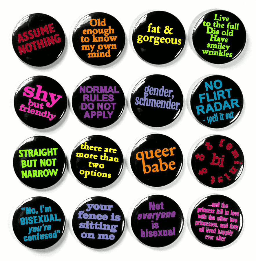 Photo of badges. All designs copyright © Jennifer Moore 1998 - 2016.