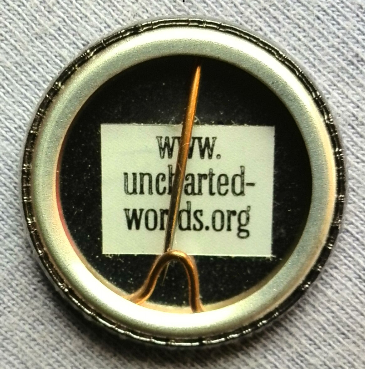 Photo of badges. All designs copyright © Jennifer Moore 1998 - 2016.